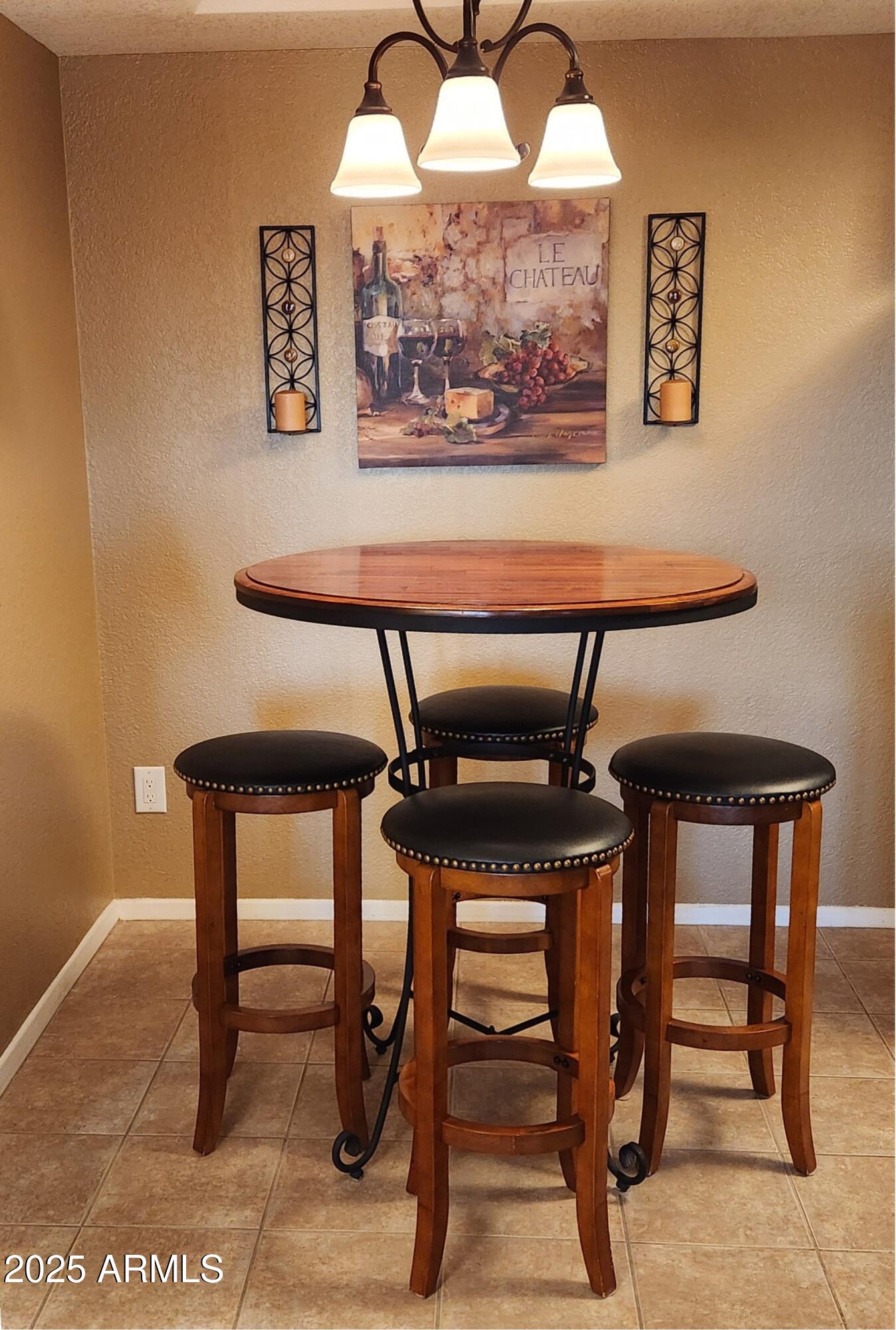 1720 East Thunderbird Road, Unit 2059 Phoenix, AZ 85022 - Photo 4 of 24 a view of dinning table and chairs in an empty room