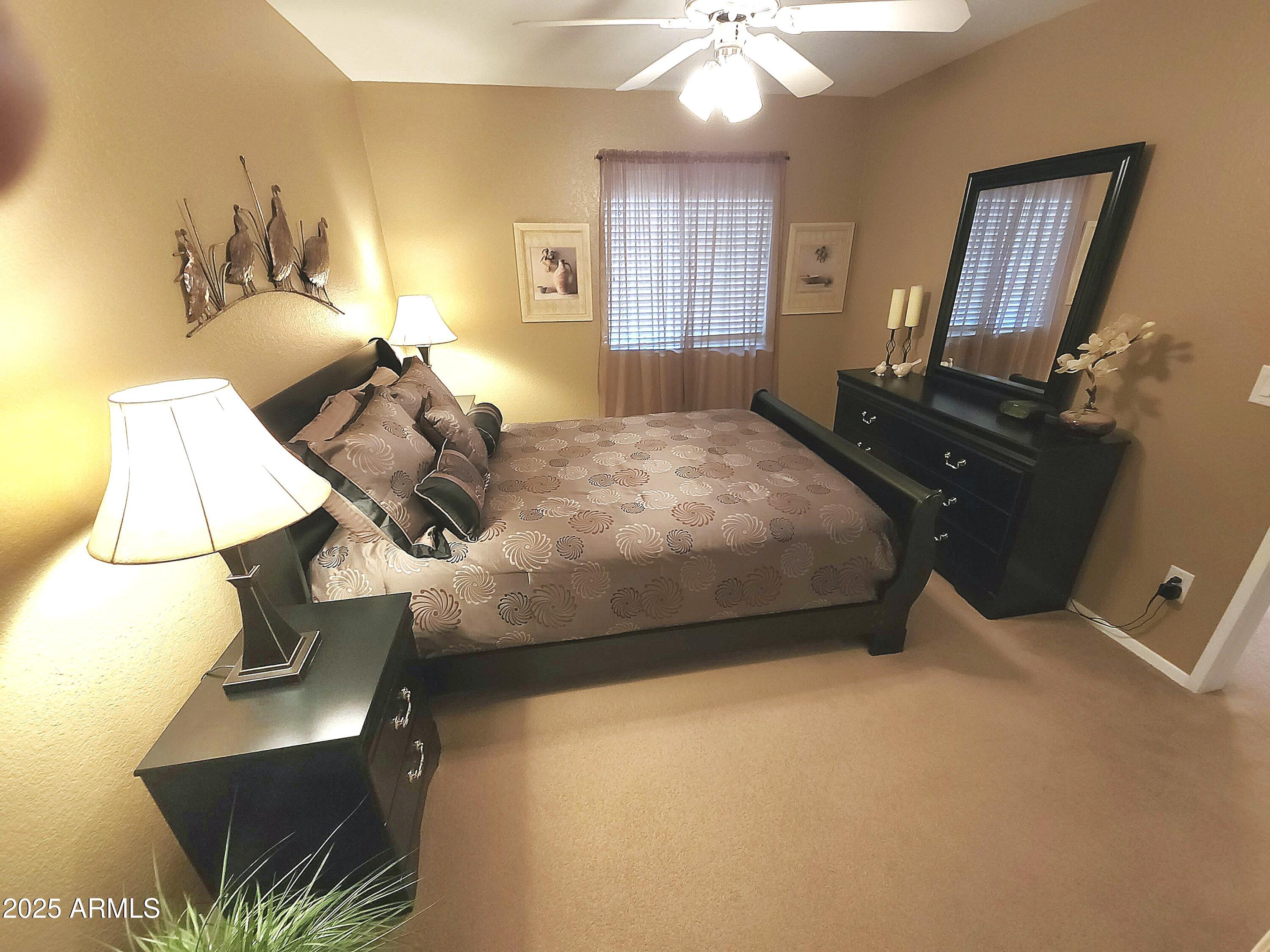 1720 East Thunderbird Road, Unit 2059 Phoenix, AZ 85022 - Photo 8 of 24 a bedroom with a bed and window