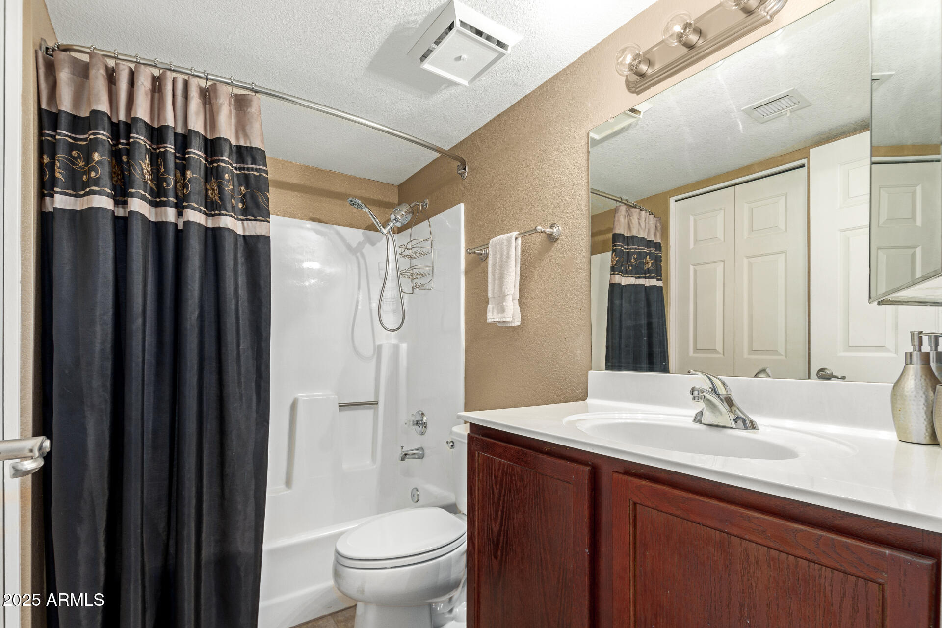 1720 East Thunderbird Road, Unit 2059 Phoenix, AZ 85022 - Photo 9 of 24 a bathroom with a double vanity sink toilet mirror and shower