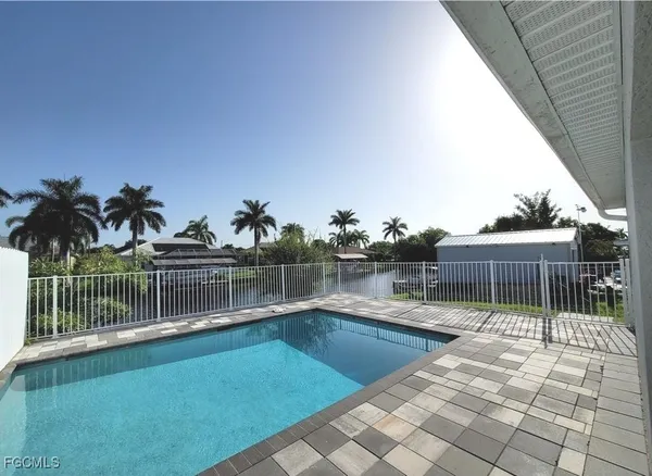 a view of swimming pool having outdoor seating