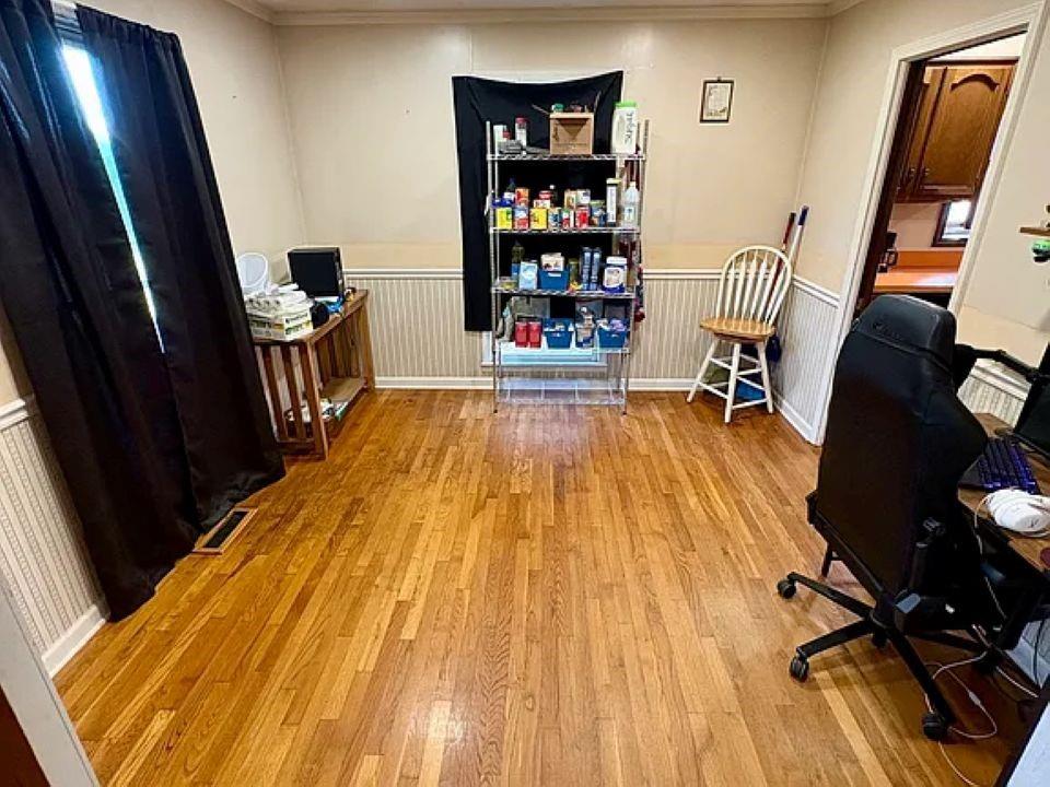 781 Thomas Street Roopville, GA 30170 - Photo 6 of 14 a room with wooden floor and furniture