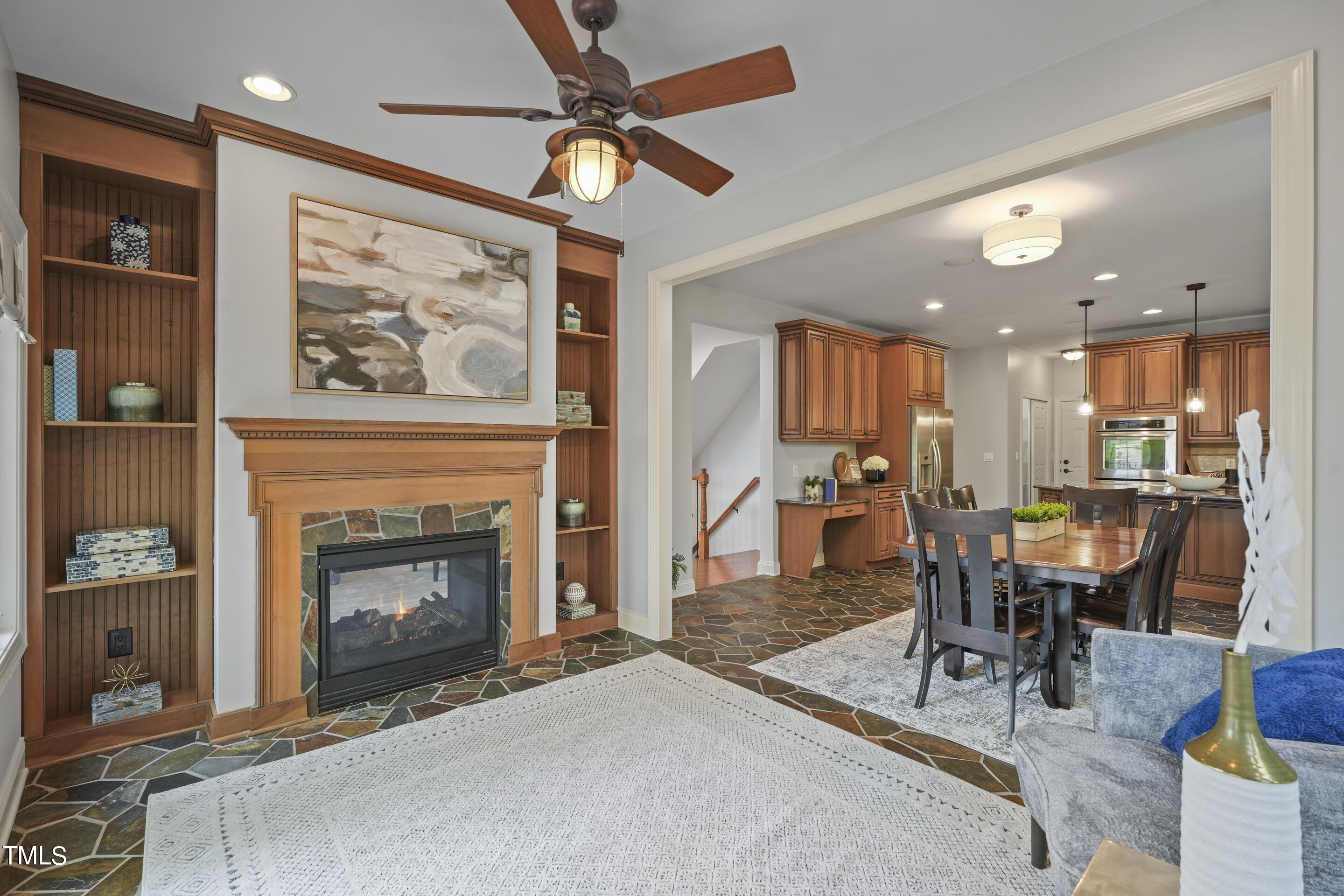 401 South Bend Drive Durham, NC 27713 - Photo 16 of 65 a living room with furniture a fireplace and a flat screen tv