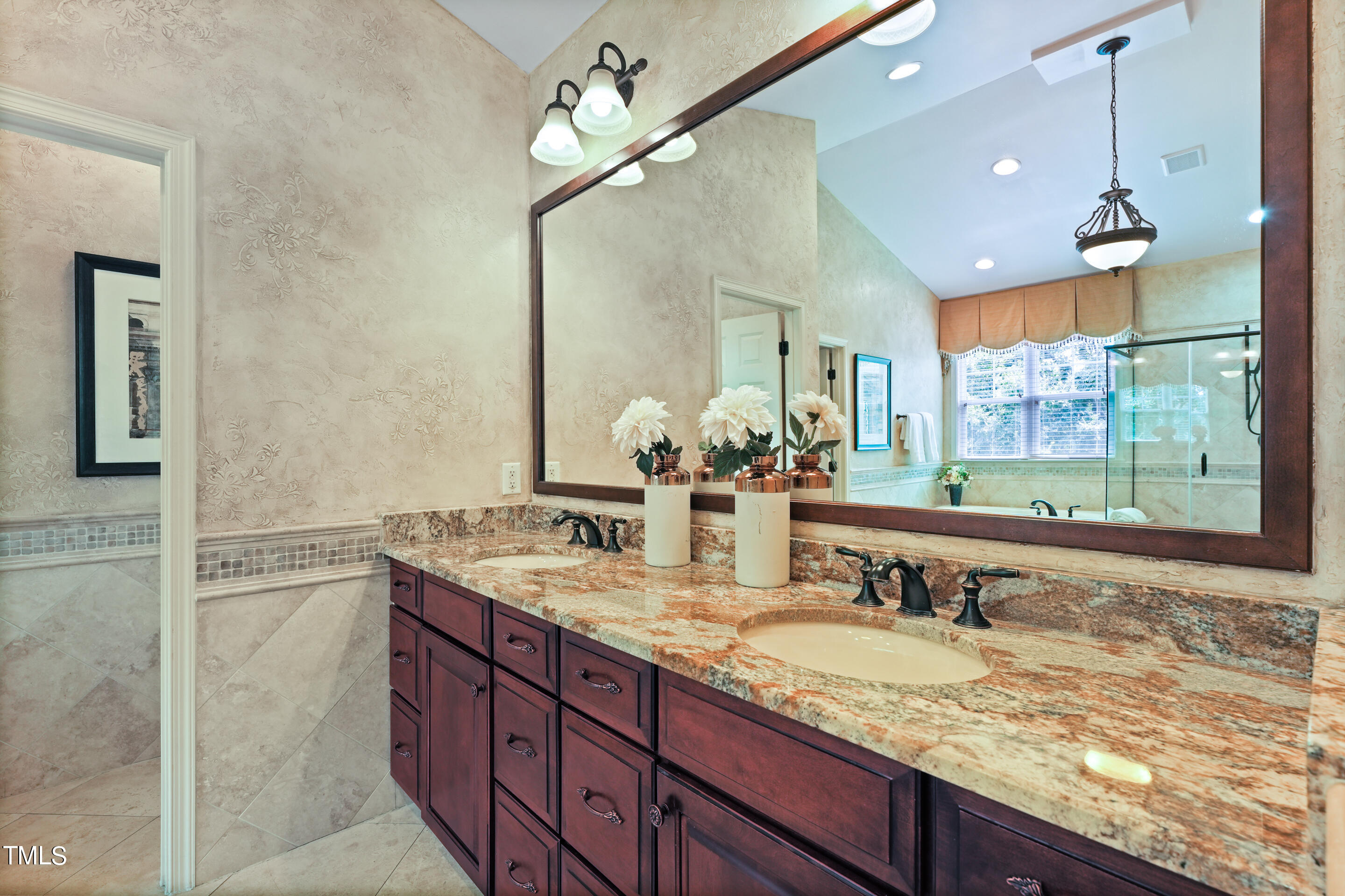 401 South Bend Drive Durham, NC 27713 - Photo 35 of 65 a bathroom with a granite countertop sink a large mirror and a shower