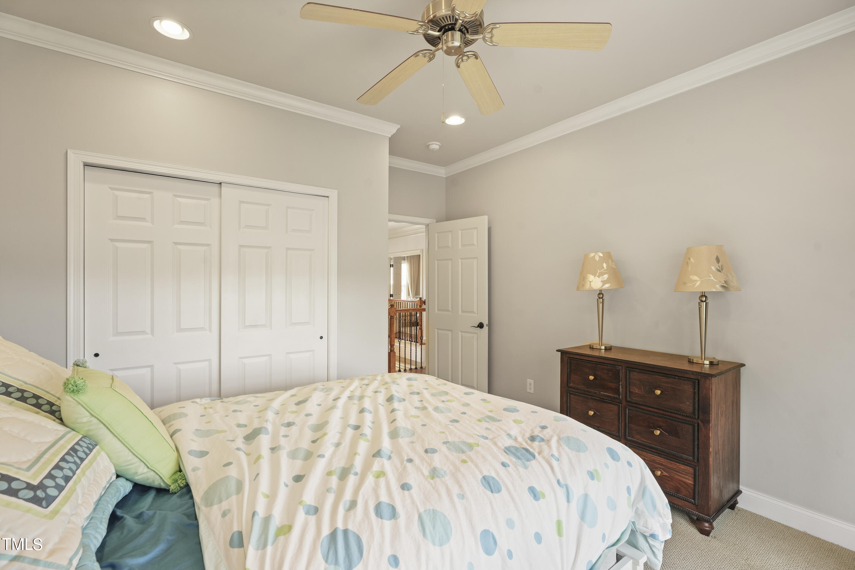 401 South Bend Drive Durham, NC 27713 - Photo 40 of 65 a bedroom with a bed and a chandelier