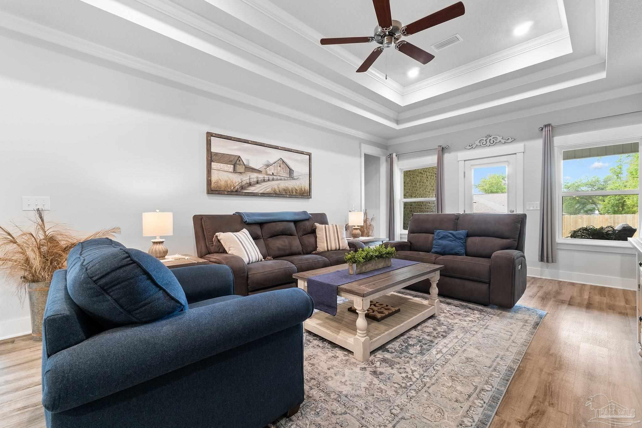 4483 Jude Way Pace, FL 32571 - Photo 11 of 30 a living room with furniture and a ceiling fan