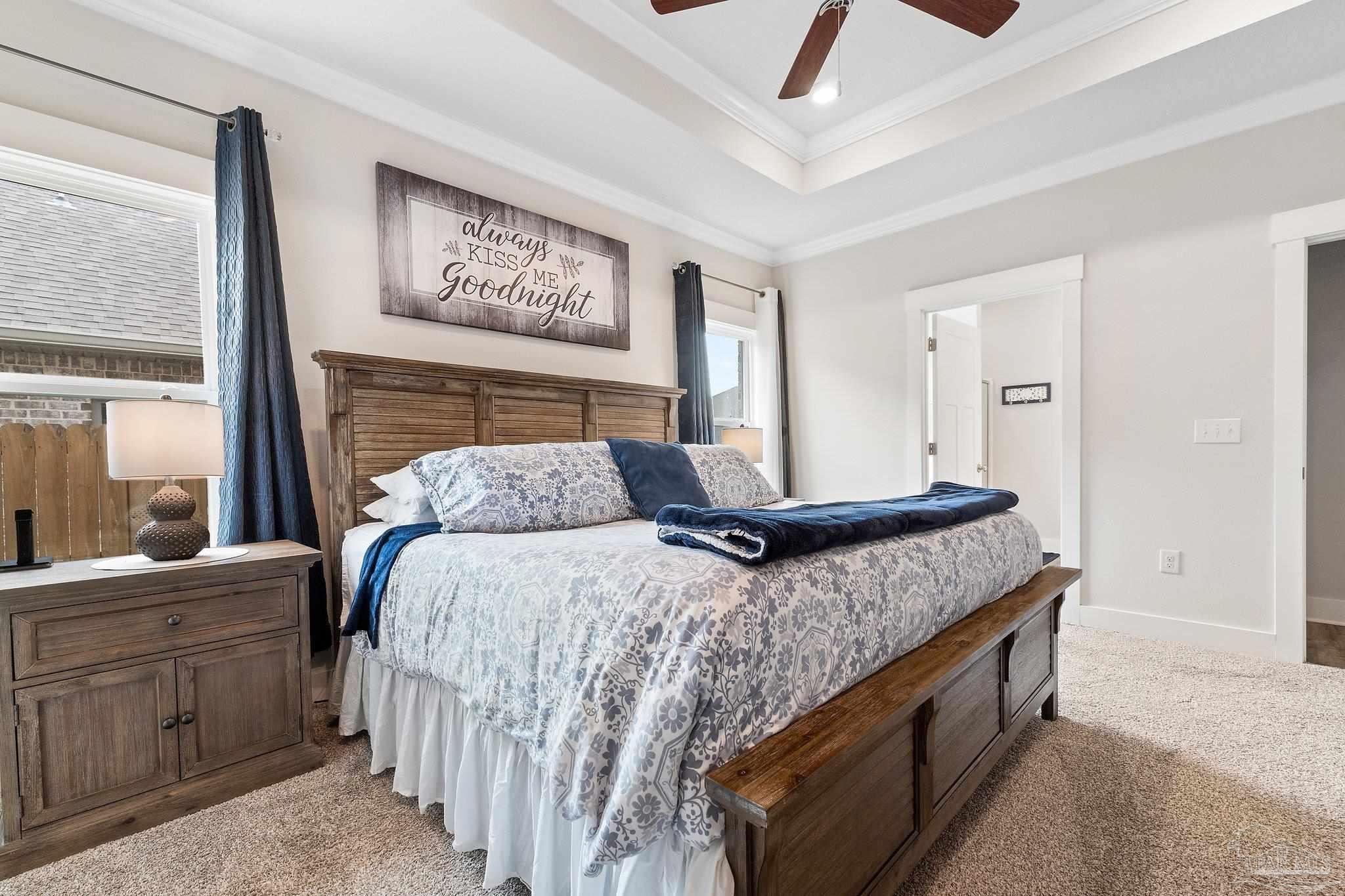 4483 Jude Way Pace, FL 32571 - Photo 14 of 30 a bedroom with a bed and large cabinets