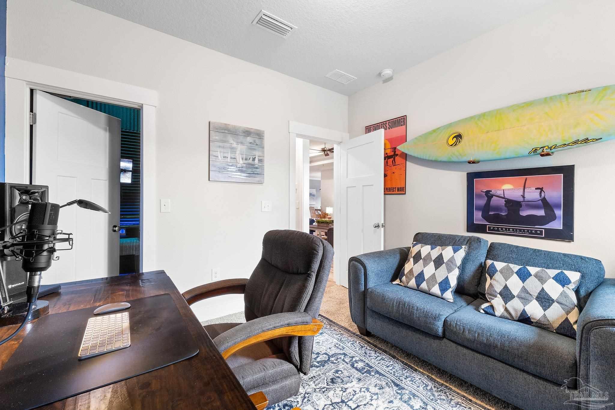 4483 Jude Way Pace, FL 32571 - Photo 20 of 30 a living room with furniture and a flat screen tv