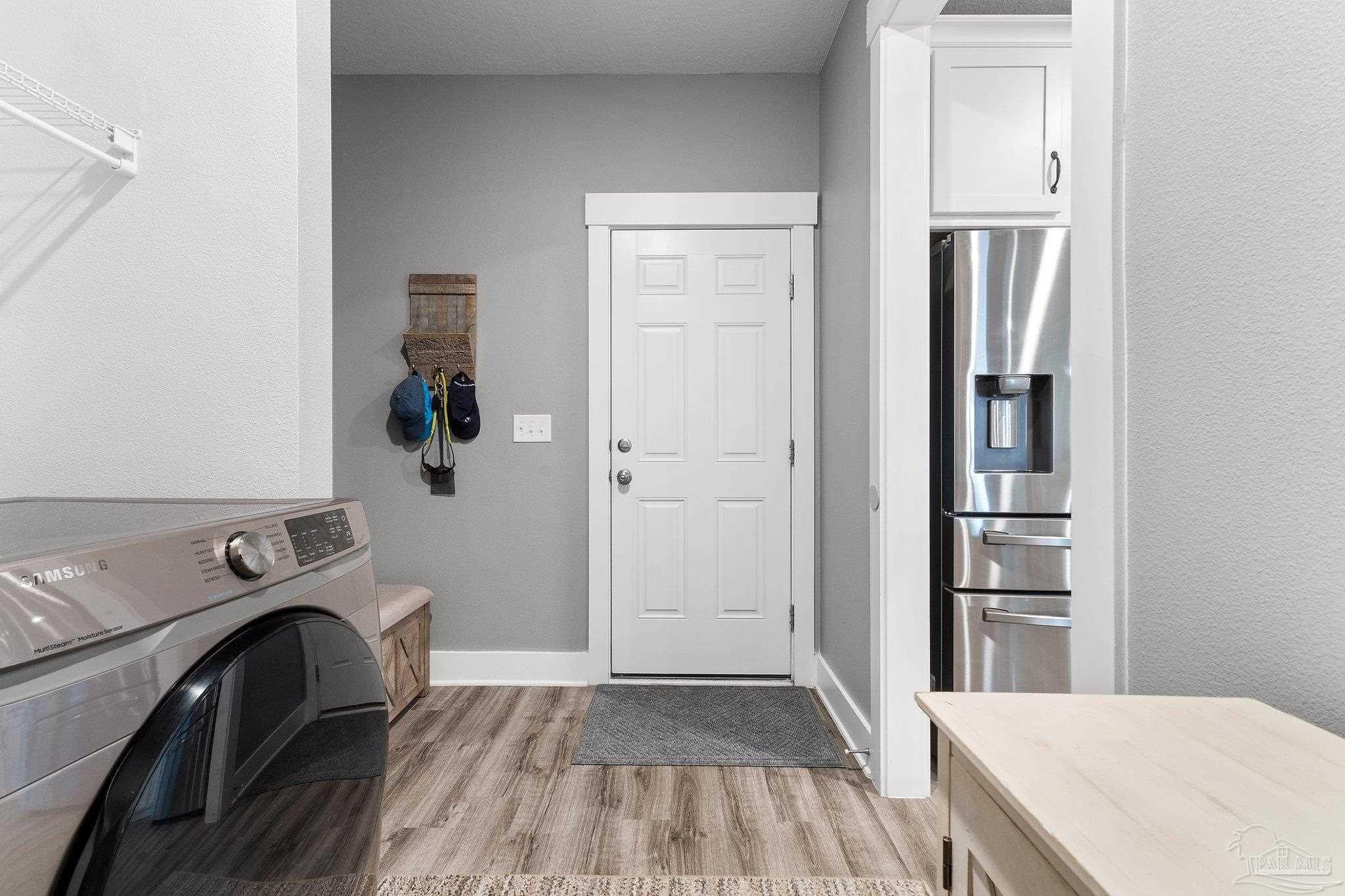 4483 Jude Way Pace, FL 32571 - Photo 25 of 30 a view of a storage and utility room with washer and dryer
