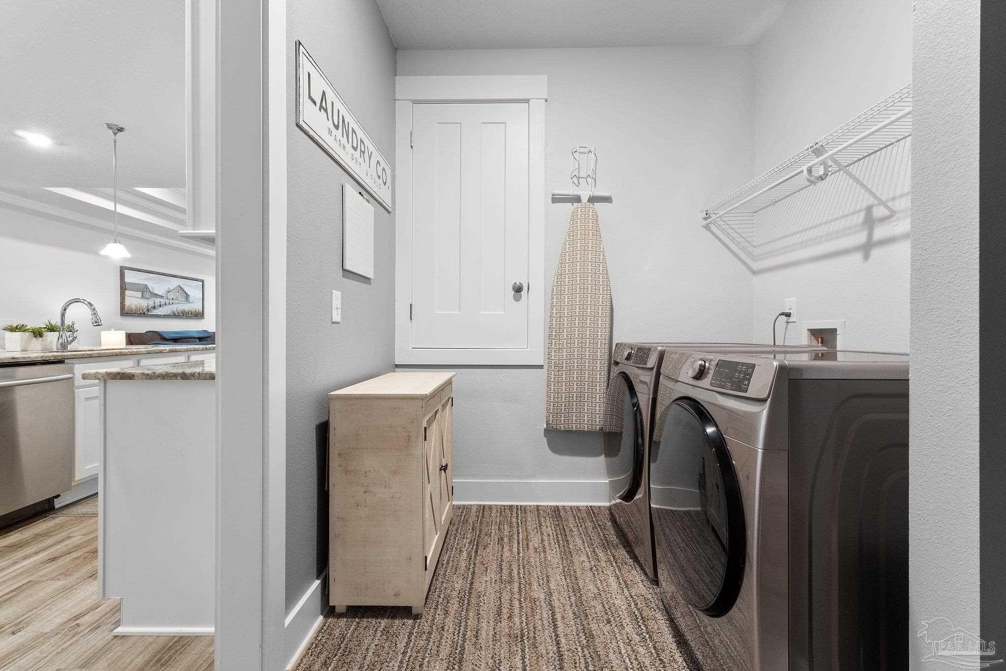 4483 Jude Way Pace, FL 32571 - Photo 26 of 30 a view of a storage and utility room with washer and dryer