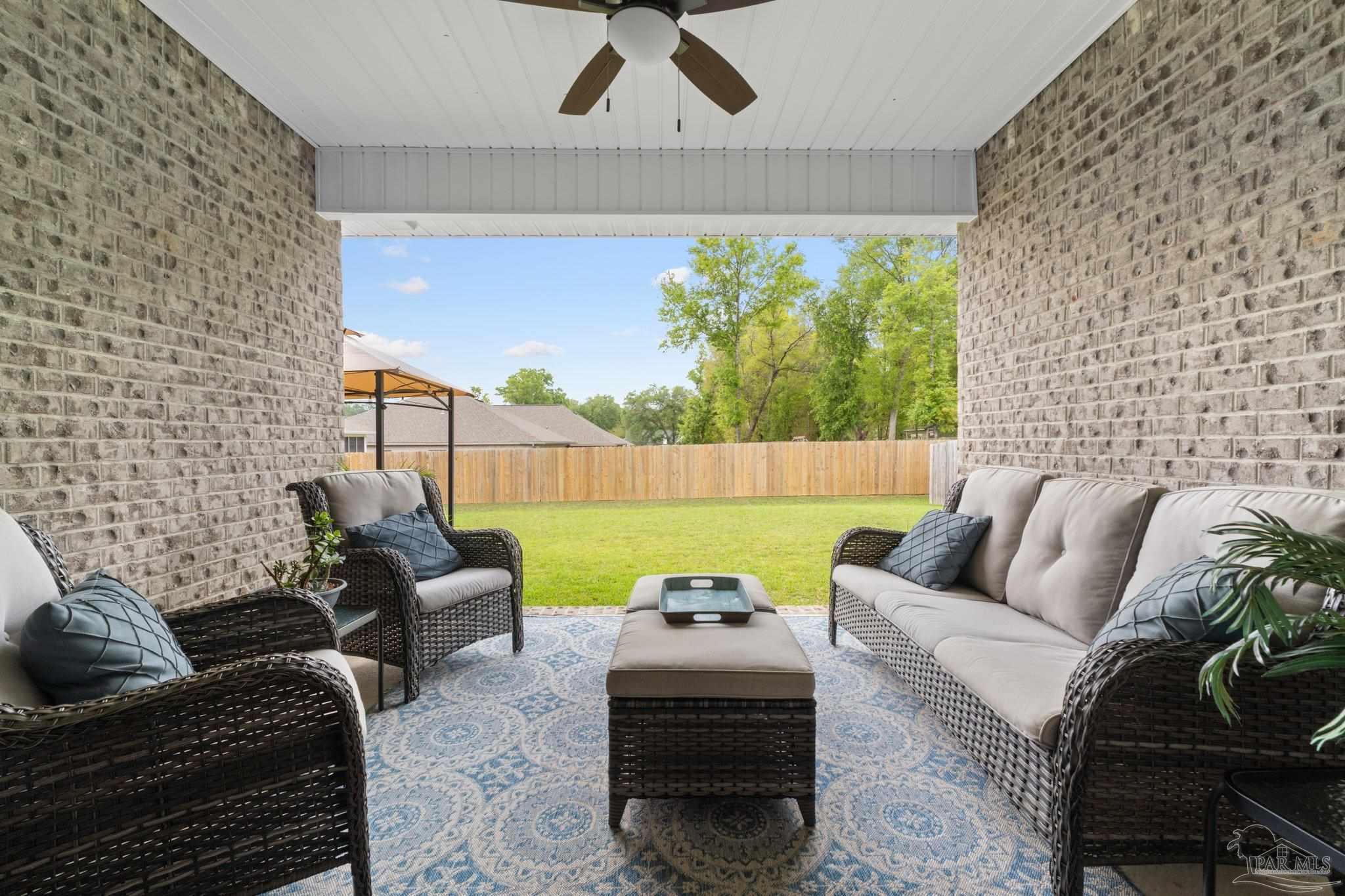4483 Jude Way Pace, FL 32571 - Photo 27 of 30 a living room with furniture and a large window