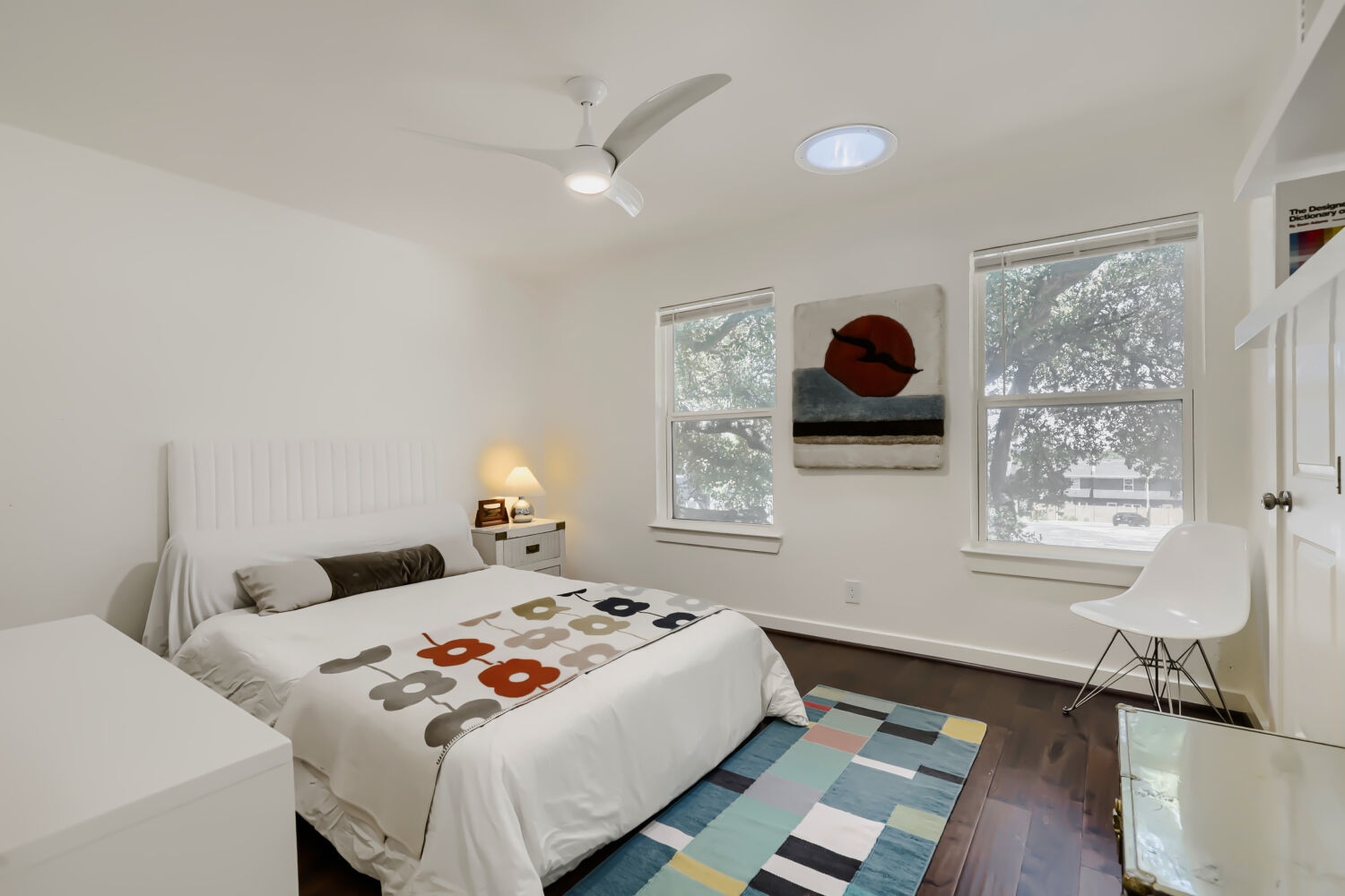 6211 Manor Road, Unit 105 Austin, TX 78723 - Photo 15 of 18 Hardwood flooring and dual windows create a bright, inviting space.