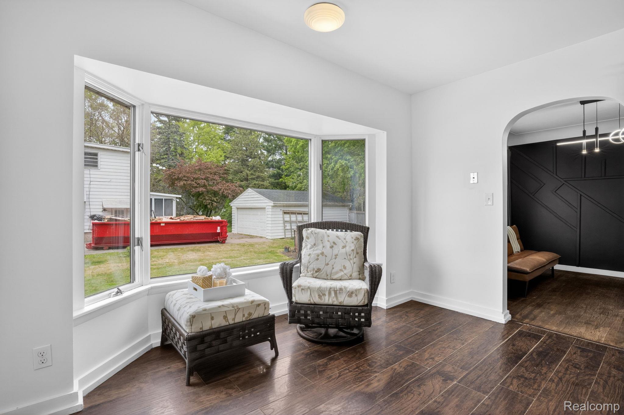 1209 Beatrice Street Flushing, MI 48433 - Photo 10 of 39 Sitting room with arched walkways and dark wood-style flooring