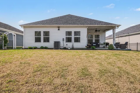 a front view of house with yard and porch