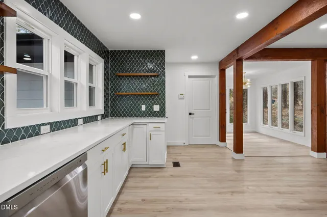 a kitchen with stainless steel appliances granite countertop a stove and a refrigerator