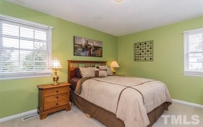 102 Rolling Ridge Circle Garner, NC 27529 - Photo 12 of 23 a bedroom with a bed and a window