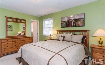 102 Rolling Ridge Circle Garner, NC 27529 - Photo 13 of 23 a bedroom with a bed and a window