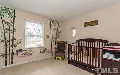 102 Rolling Ridge Circle Garner, NC 27529 - Photo 15 of 23 a bedroom with windows