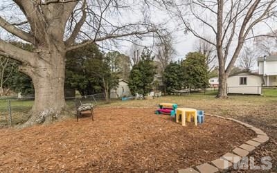 102 Rolling Ridge Circle Garner, NC 27529 - Photo 19 of 23 a backyard of a house with table and chairs