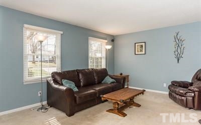 102 Rolling Ridge Circle Garner, NC 27529 - Photo 3 of 23 a living room with furniture and a window