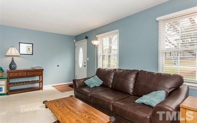 102 Rolling Ridge Circle Garner, NC 27529 - Photo 6 of 23 a living room with furniture and a window