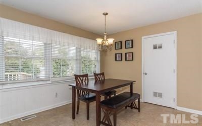 102 Rolling Ridge Circle Garner, NC 27529 - Photo 7 of 23 a dining room with furniture and window