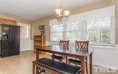 102 Rolling Ridge Circle Garner, NC 27529 - Photo 8 of 23 a view of a dining room with furniture window and outside view