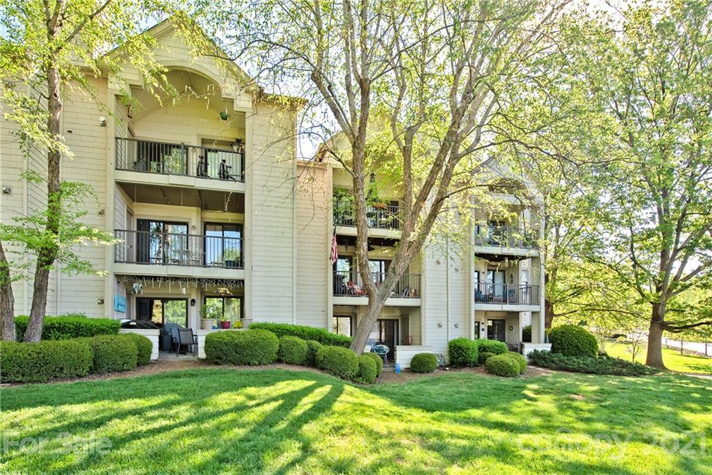 18809 Nautical Drive, Unit 302 Cornelius, NC 28031 - Photo 1 of 22 a view of an apartment with a garden and plants
