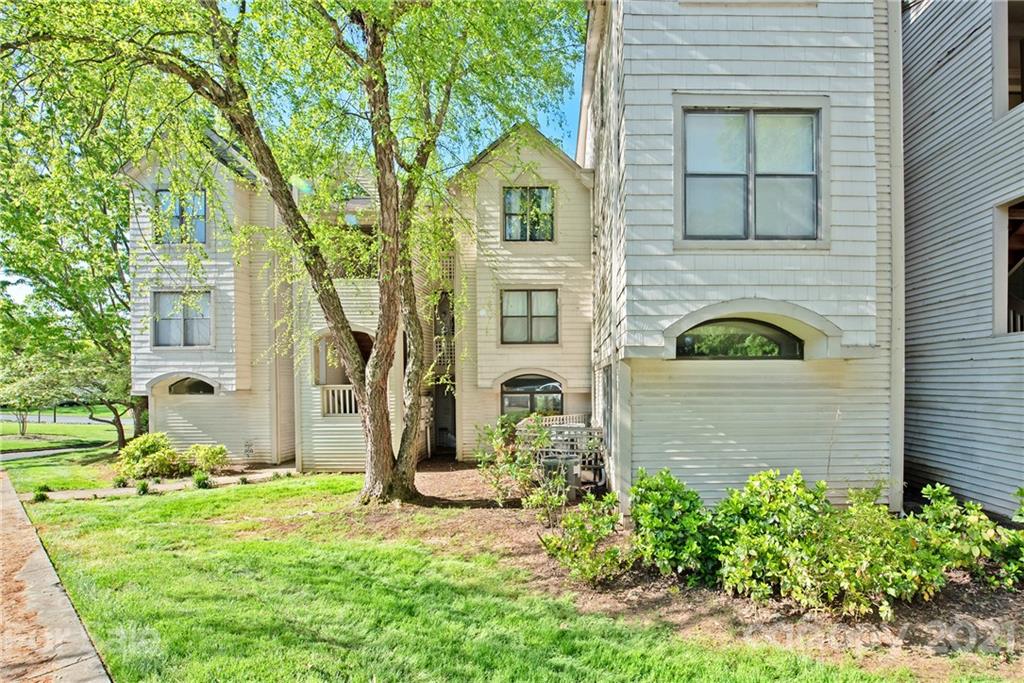 18809 Nautical Drive, Unit 302 Cornelius, NC 28031 - Photo 2 of 22 a front view of a house with garden
