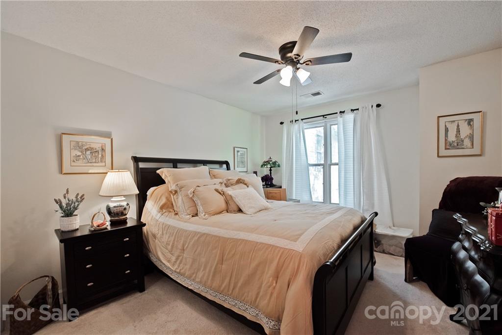 18809 Nautical Drive, Unit 302 Cornelius, NC 28031 - Photo 16 of 22 a bedroom with a bed and window