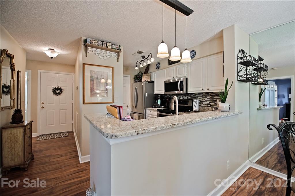 18809 Nautical Drive, Unit 302 Cornelius, NC 28031 - Photo 5 of 22 a view of living room and kitchen