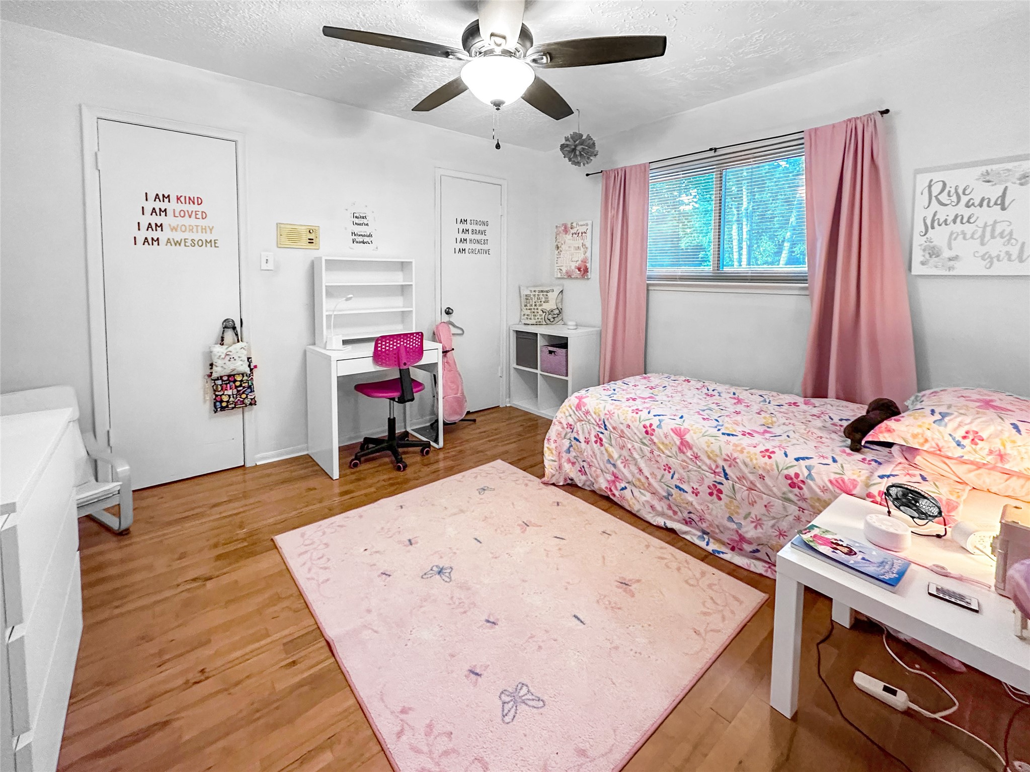 6511 Castle Pine Lane Spring, TX 77379 - Photo 31 of 49 Inviting bedroom filled with charm and comfort, highlighted by soft natural lighting, stylish accents, and generous floor space for flexible furniture placement. Dual closet doors. Bedroom #2