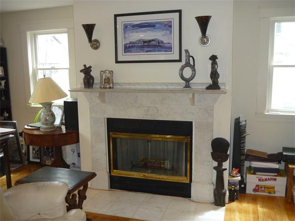 238 Clark Road Brookline, MA 02445 - Photo 8 of 17 a living room with furniture and a fireplace