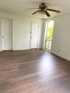 a view of walk in closet with empty racks
