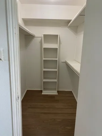 a kitchen with a stove top oven and cabinets