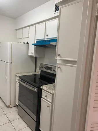 a view of kitchen with furniture