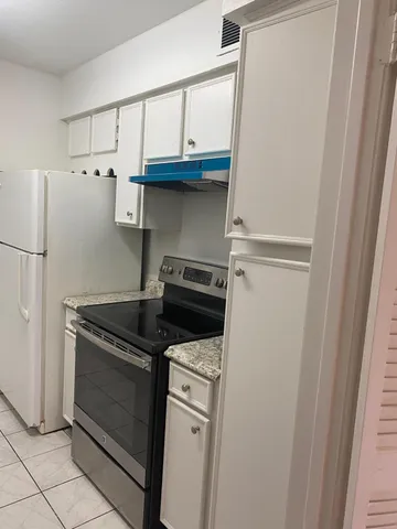 a view of kitchen with furniture