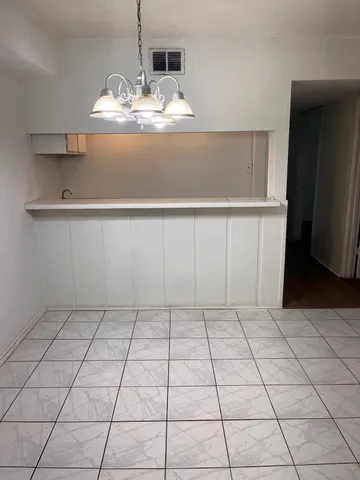 a room with a sink and a mirror
