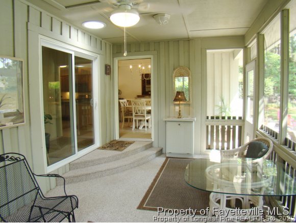 155 Longleaf Road Southern Pines, NC 28387 - Photo 14 of 24 a living room with furniture and a large window