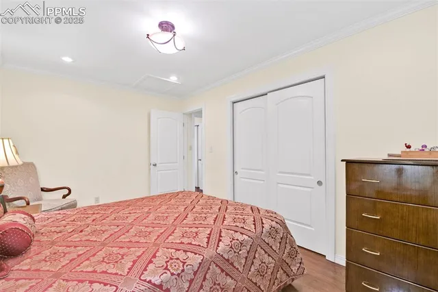 a bedroom with a bed and cabinets