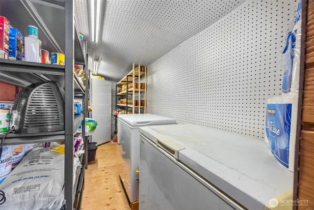 aerial view of a house with patio and a yard
