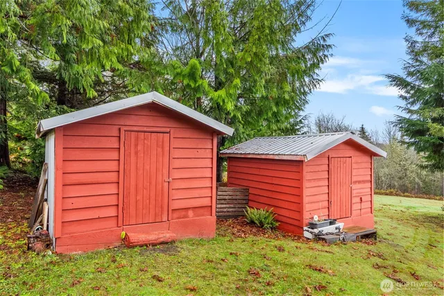 a view of a field with a tree in the background