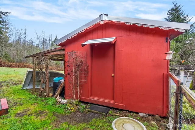 a green field with lots of trees