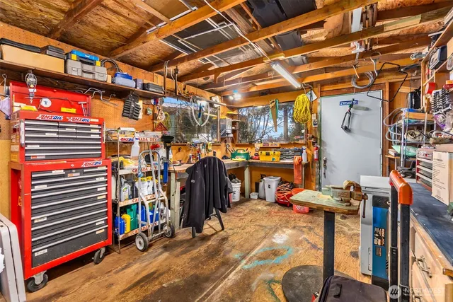 an aerial view of residential house with outdoor space and swimming pool