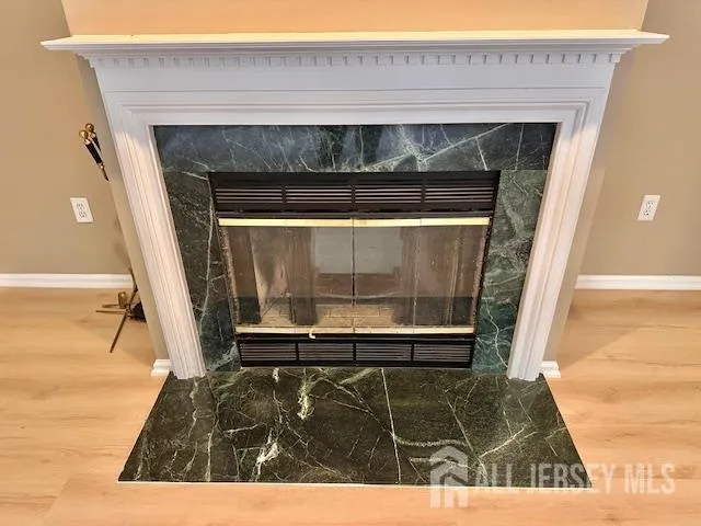 a view of living room with a fireplace and a rug