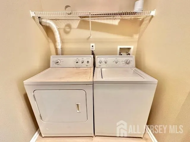a view of a hall with furniture and a window