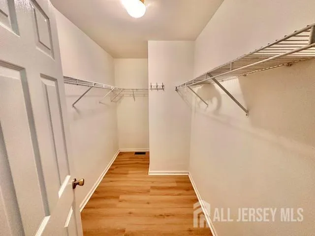 a bath tub sitting next to a window