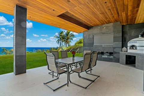 a patio with garden area and outdoor seating