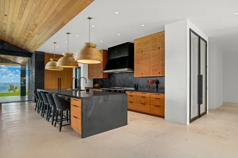 a kitchen with stainless steel appliances granite countertop a stove and refrigerator