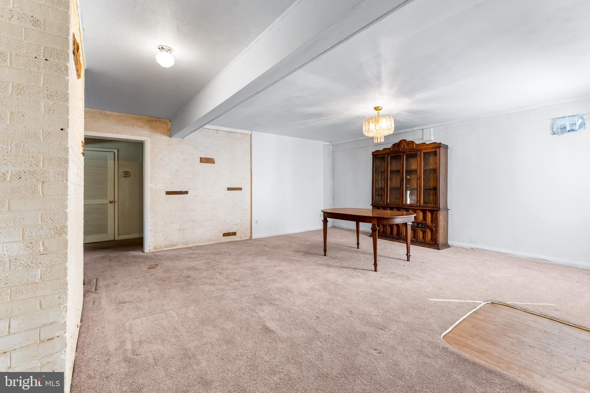 1112 Owens Road Oxon Hill, MD 20745 - Photo 17 of 30 a room with furniture and a chandelier