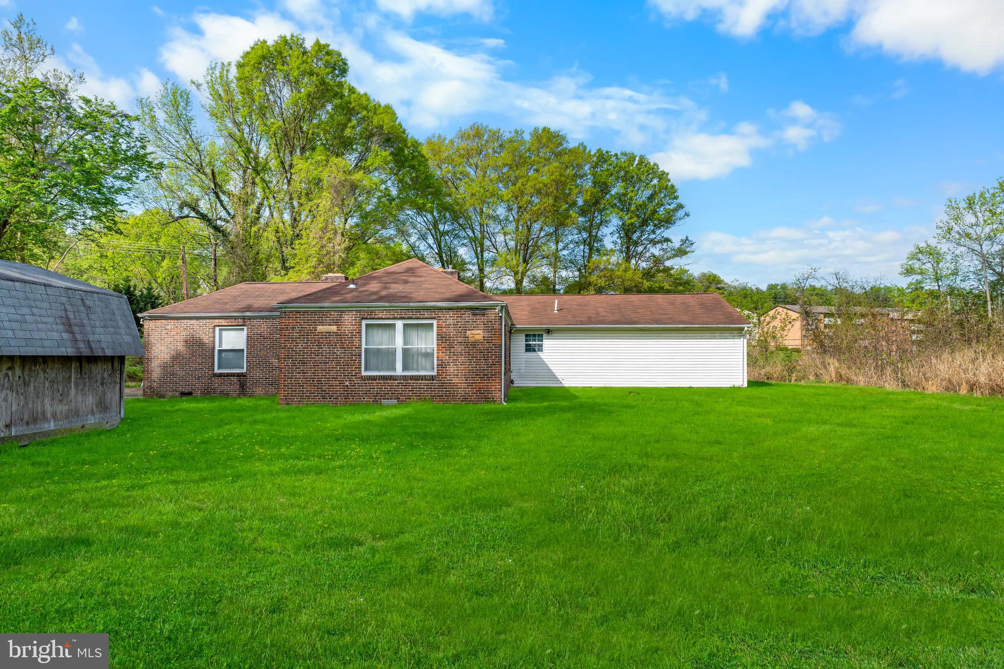 1112 Owens Road Oxon Hill, MD 20745 - Photo 3 of 30 a front view of a house with garden